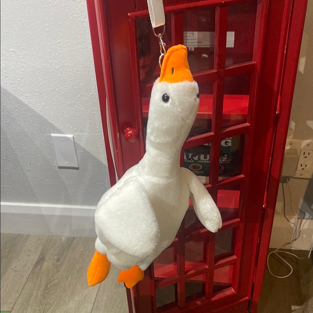 Plush White and Orange Bird purse.